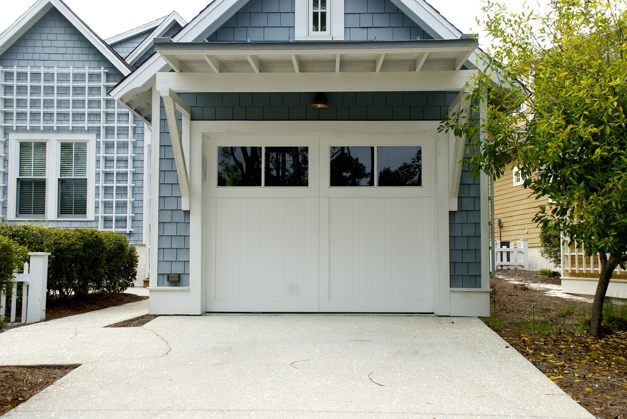 What types of warranties are offered by garage door repair services for their service and parts?